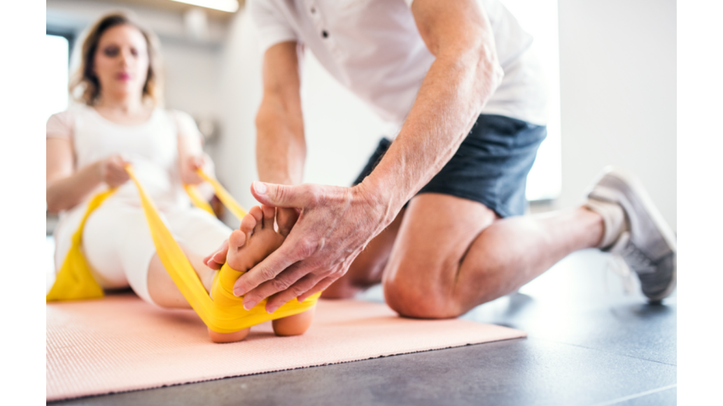 physical therapist using a THERABAND
