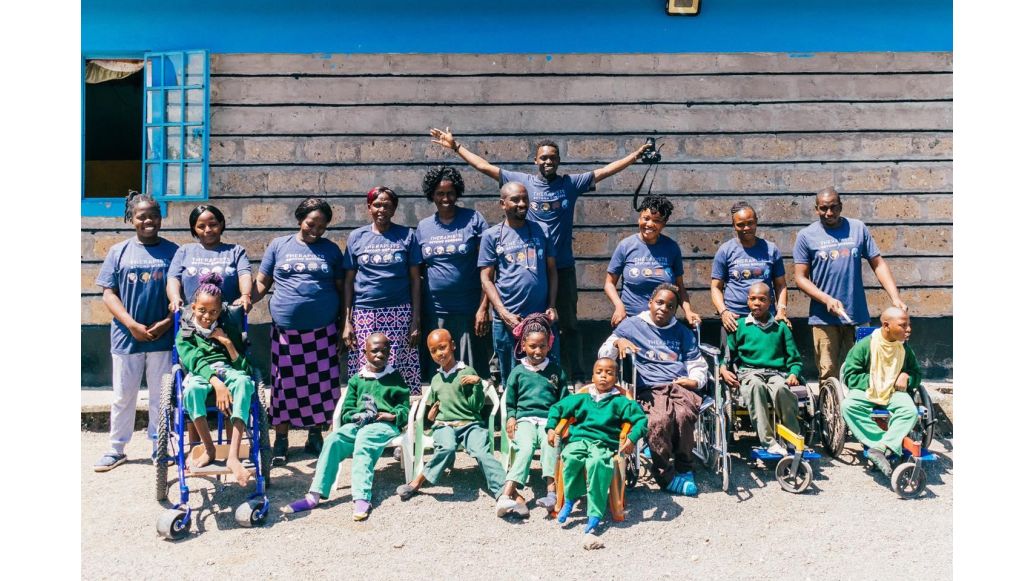 Therapist Beyond Borders volunteers pictured with a group of disabled children