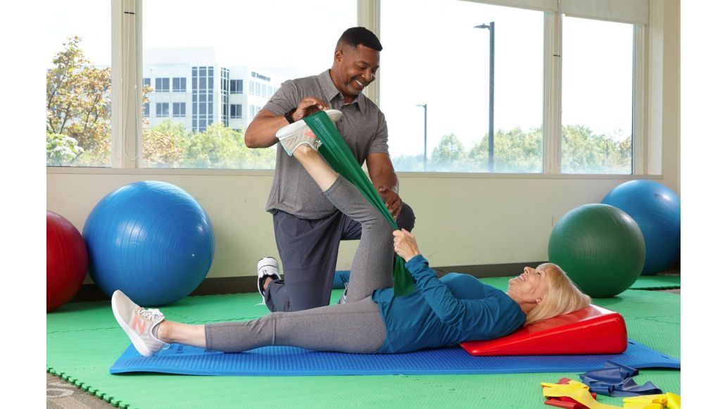clinicians having patient use THERABAND flexbar