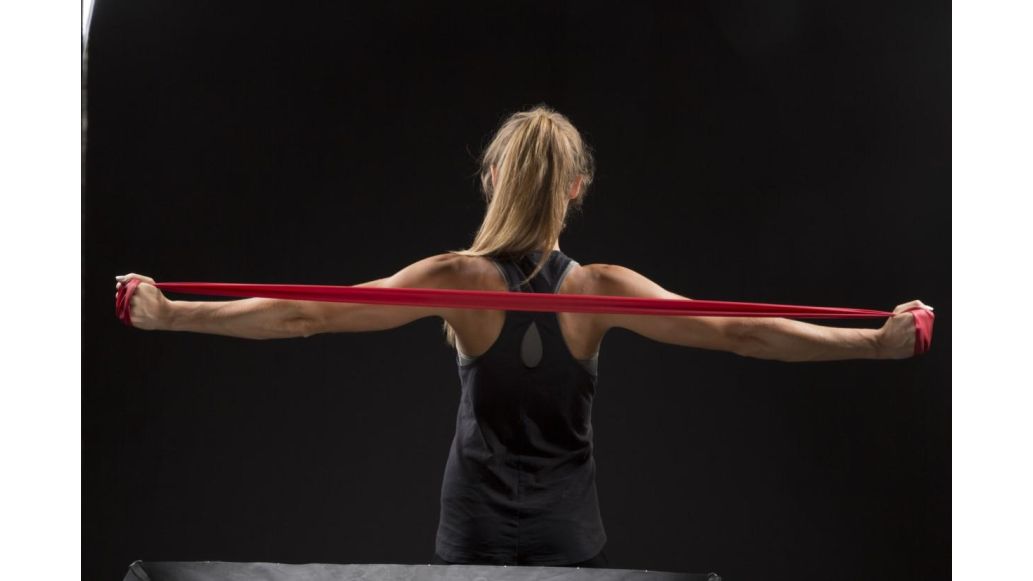 woman stretching theraband