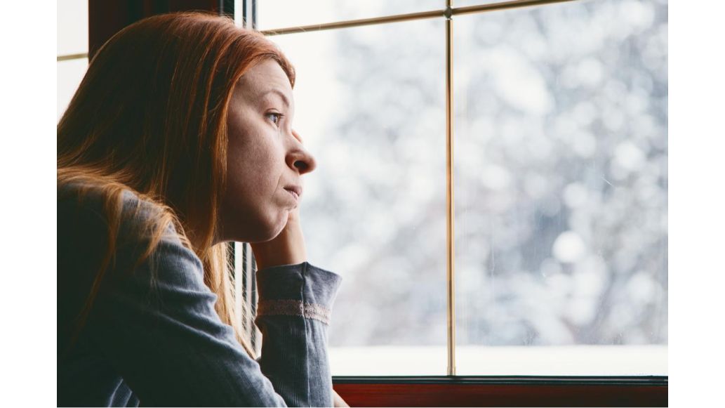 Woman looking out the window
