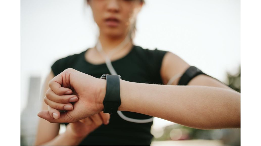 woman checking pedometer