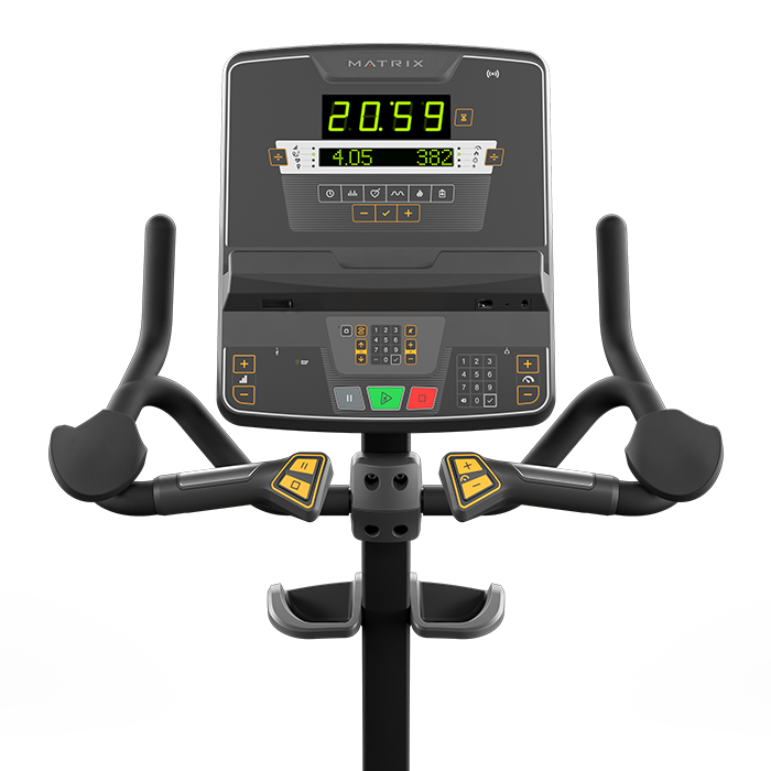 Side view of the dark gray & black Matrix Endurance Upright Cycle against a plain white background.