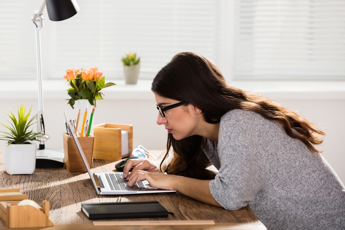 woman working intently on computer