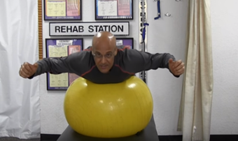 man doing superman on exercise ball