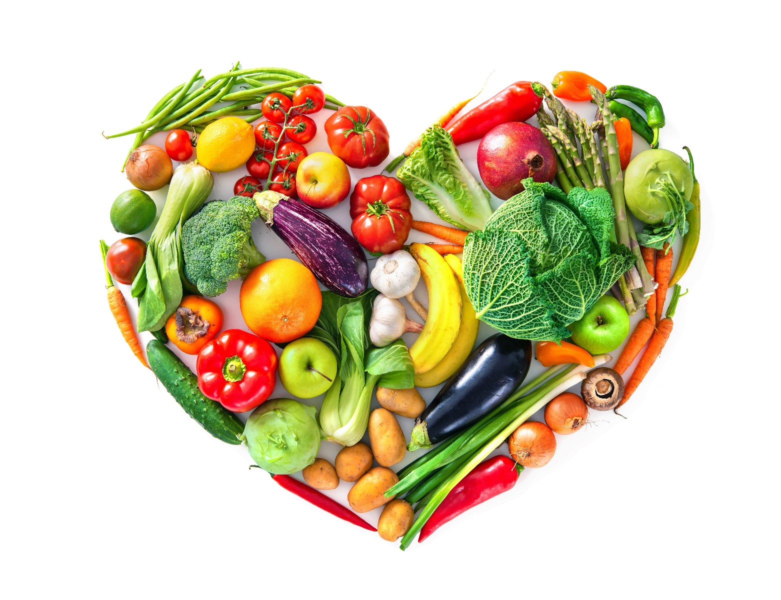 Colorful assortment of vegetables in the shape of a heart against a white background