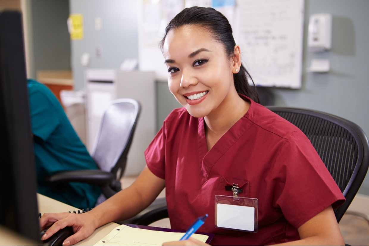 health professional on computer