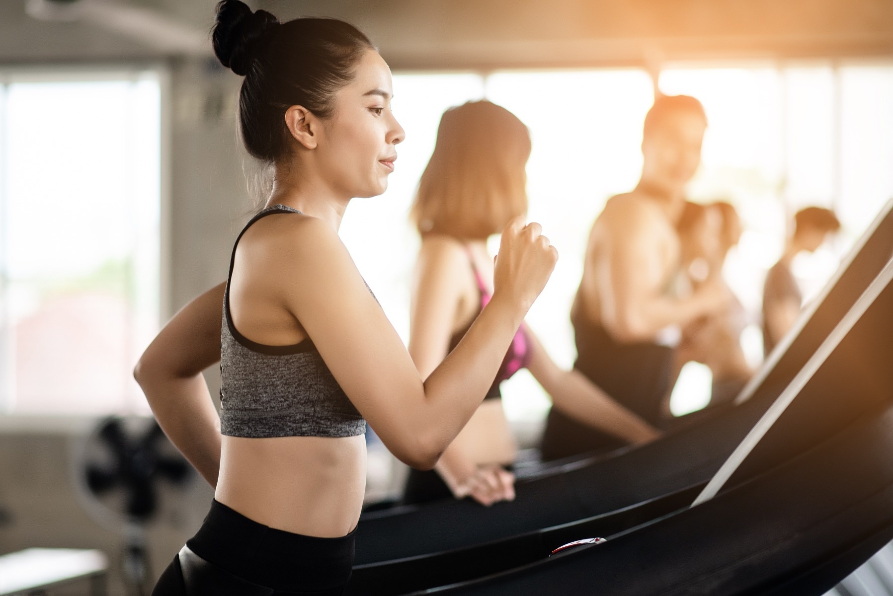 woman running on treadmill