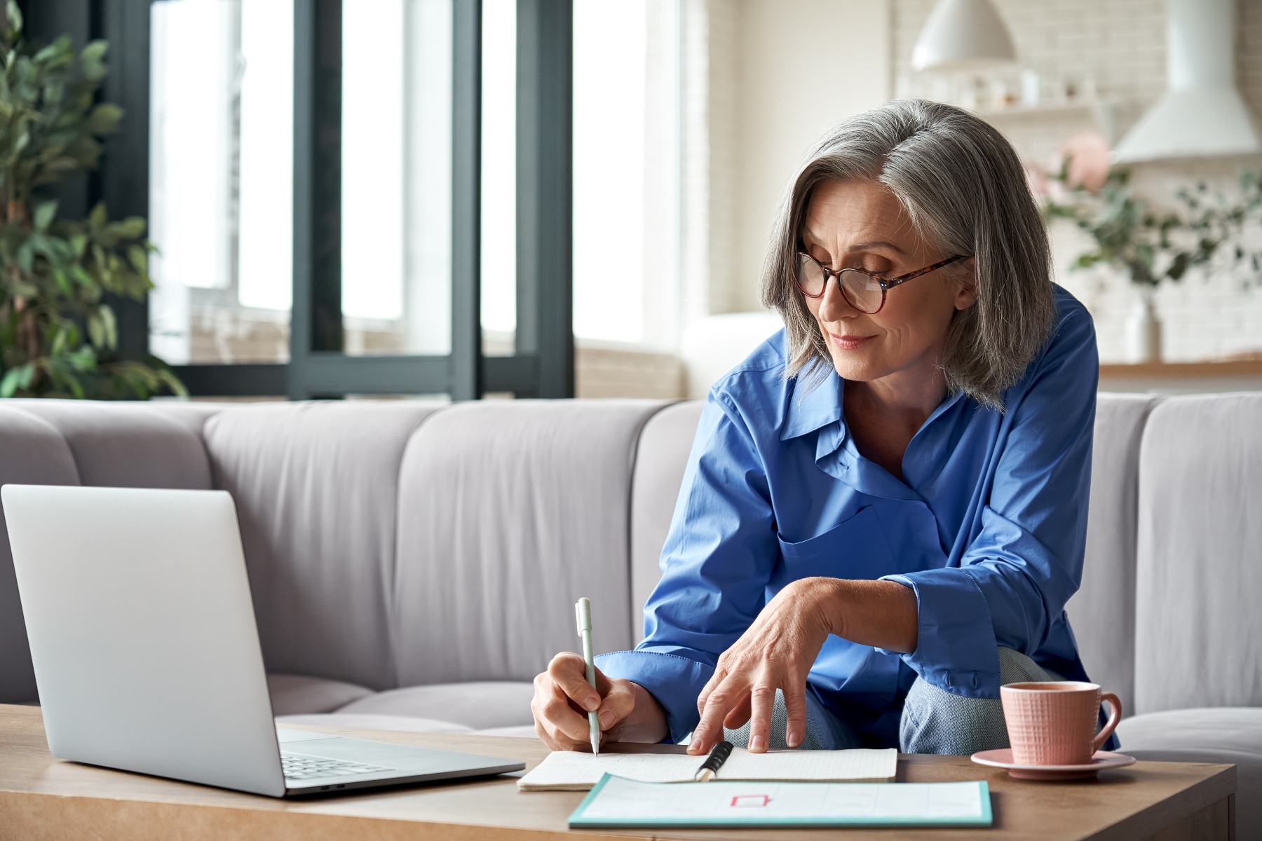 older woman writing