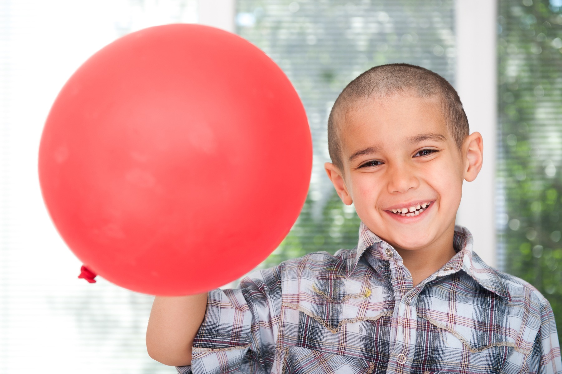 boy holding balloon