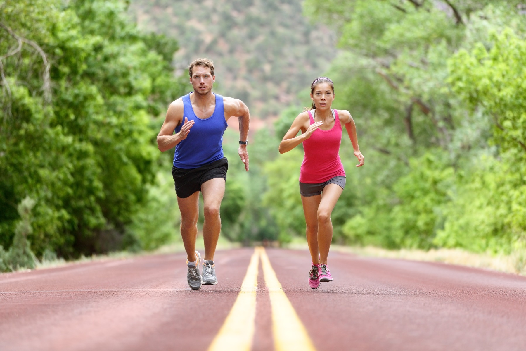 two people running down the road