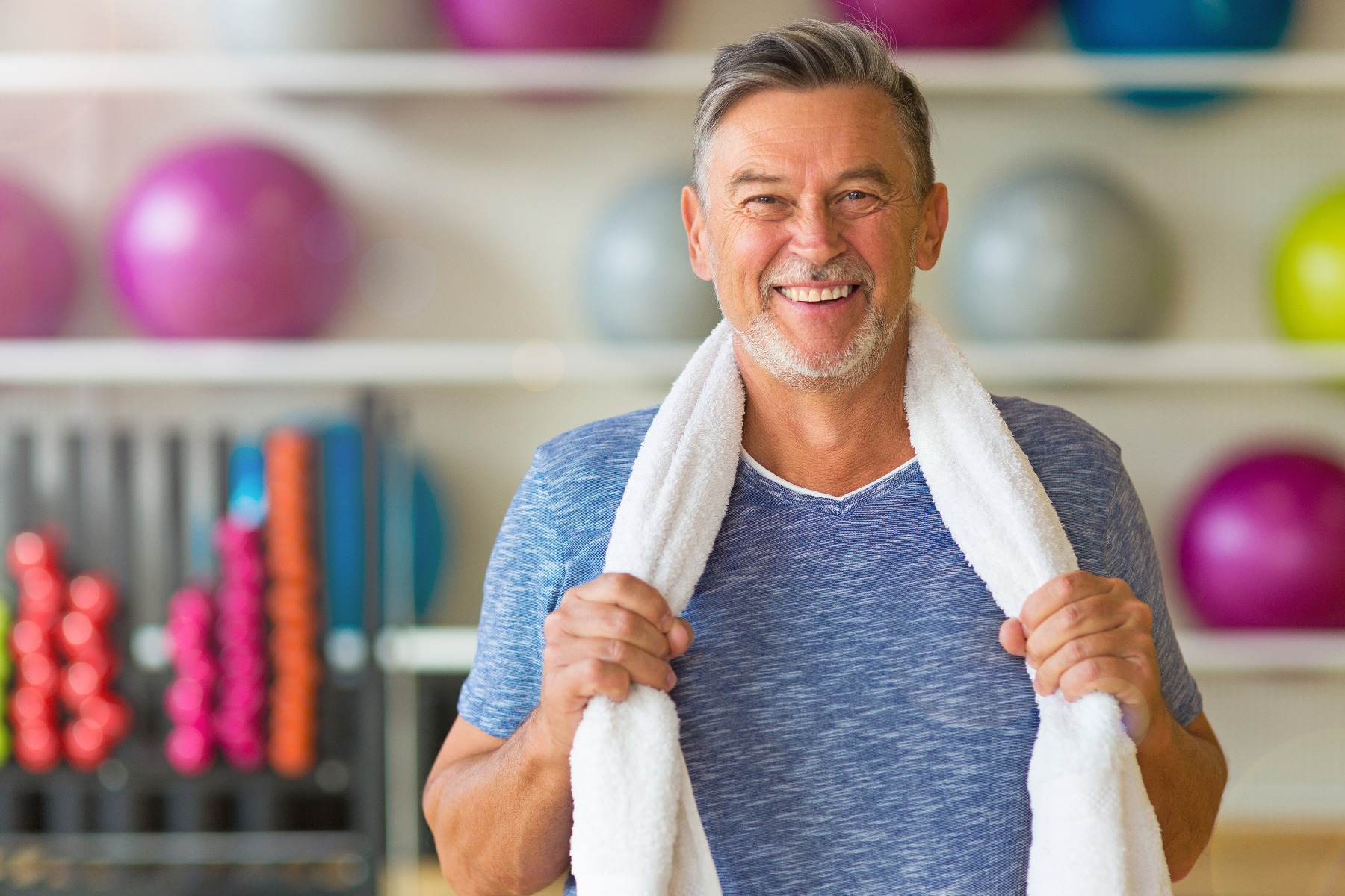 man at gym with towel