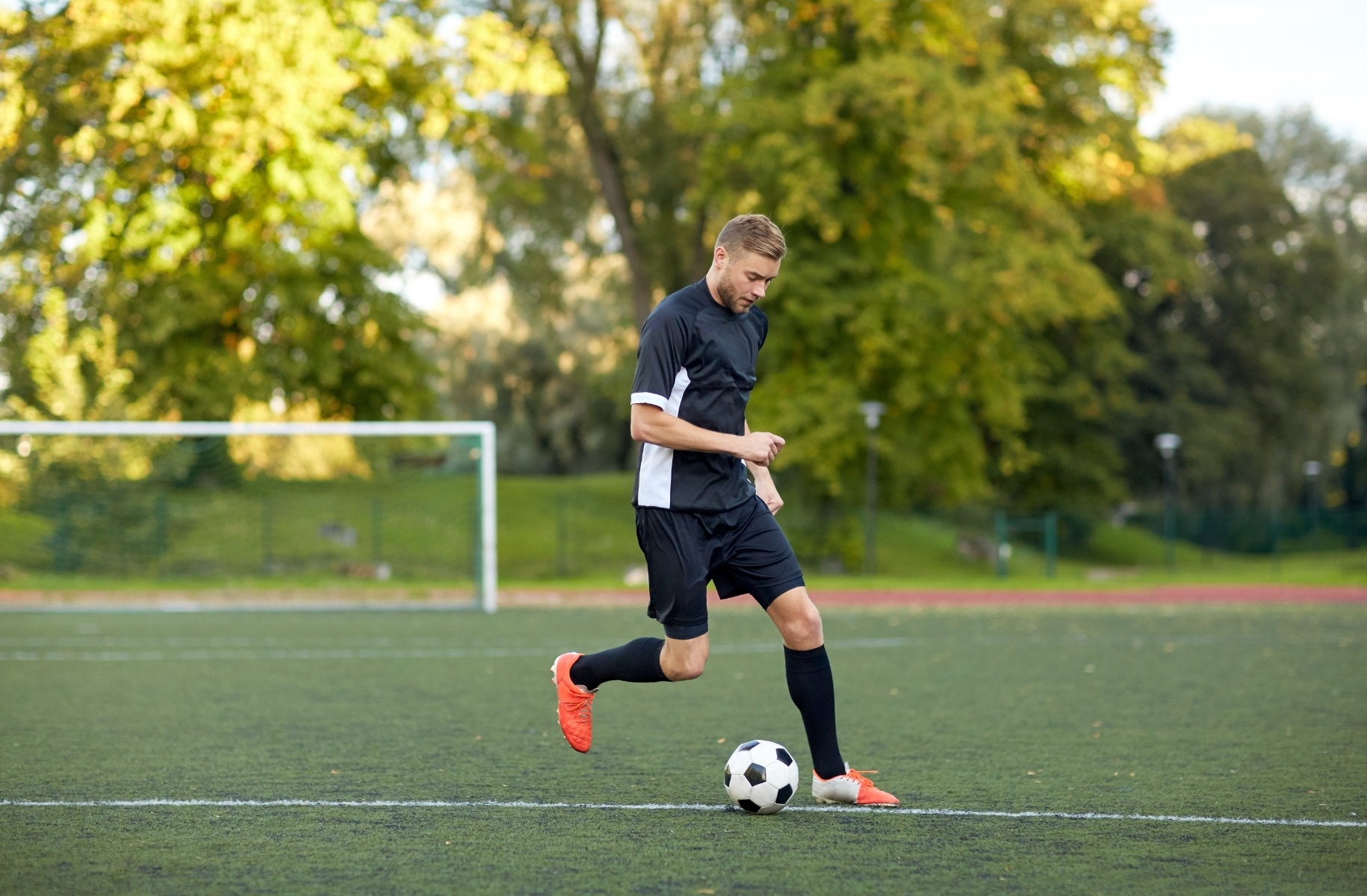 person playing soccer on a field