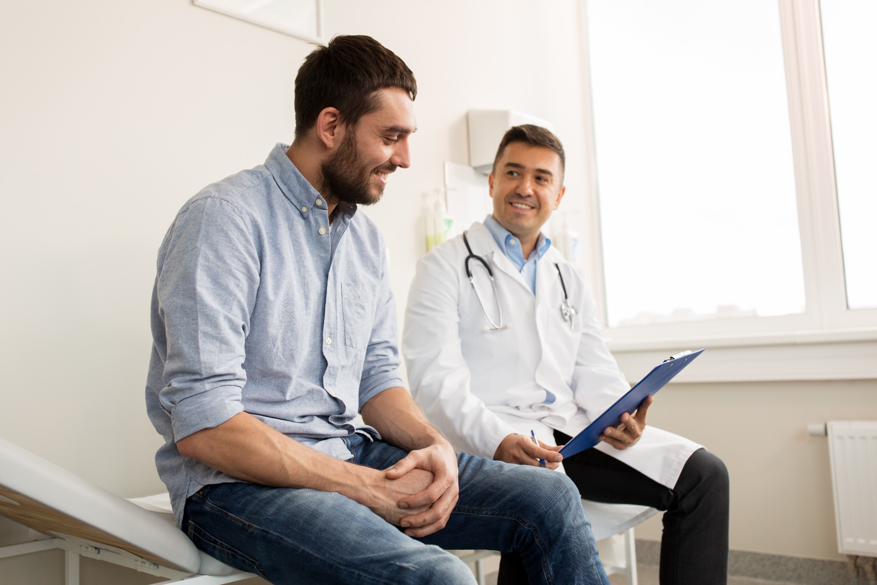 male patient talking with male doctor